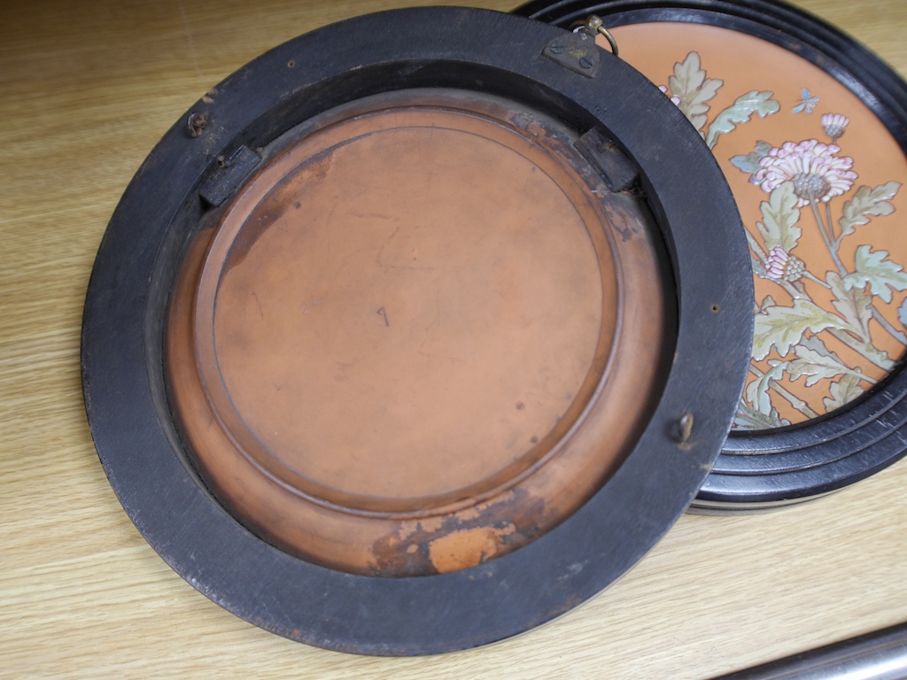 A pair of framed Victorian Aesthetic period terracotta dishes, possibly Watcombe pottery, 33cm total diameter. Condition - fair to good